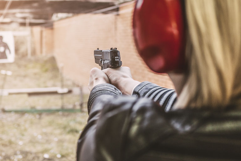 Woman handgun range gun training